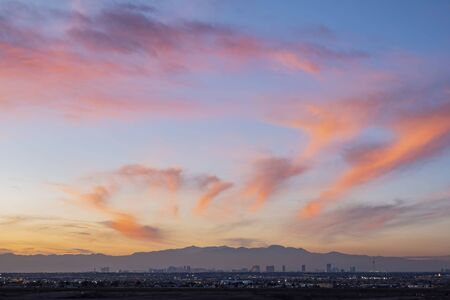 Sunset aerial view of the strip with mountain behind at Las Vegas, Nevadaの写真素材