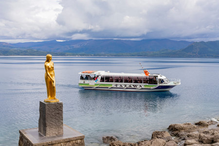 Akita, OCT 23: Statue of Tatsuko with ship in Lake Tazawako on OCT 23, 2019 at Akita, Japan