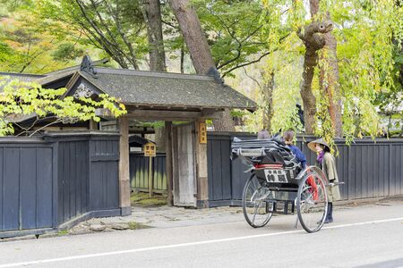 Kakunodate, OCT 21: Visitor sit in pulled rickshaw enjoying the view of Kakunodate Samurai House on OCT 21, 2019 at Kakunodate, Japanのeditorial素材
