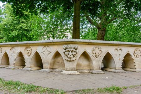 Historical statue chair near city wall at York, United Kingdomの写真素材