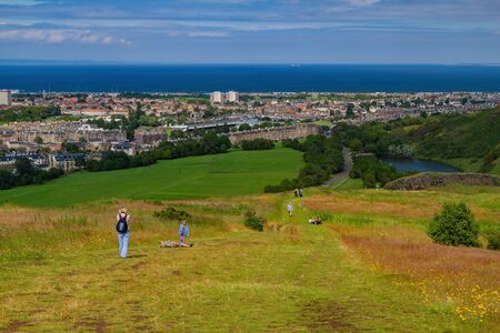 Edinburgh, JUL 11: High angle view of the cityscape from Holyrood Park on JUL 11, 2011 at Edinburghのeditorial素材