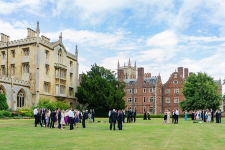 Cambridge, JUL 10: Student holding a wedding party at New Court, St John's College on JUL 10, 2011 at Cambrdige, United Kingdomのeditorial素材