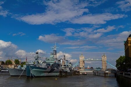 London, JUL 9: Afternoon view of the HMS Belfast and tower bridge on JUL 9, 2011 at London, United Kingdomのeditorial素材