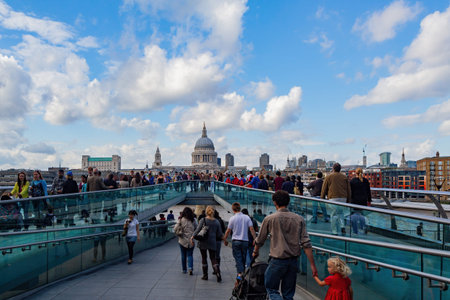 London, JUL 9: Afternoon view of the St. Paul's Cathedral, Millennium Bridge and Thames River on JUL 9, 2011 at London, United Kingdomのeditorial素材