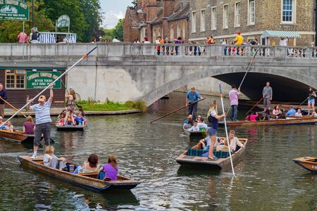 Cambridge, JUL 10: Student punting in the River Cam on JUL 10, 2011 at Cambridge, United Kingdomのeditorial素材