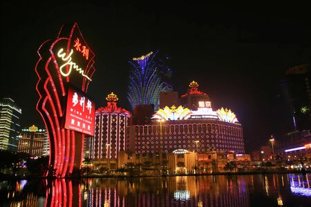 Macau, FEB 8: Night view of the Wynn sign and Grand Lisboa Casino with reflection on FEB 8, 2008 at Macau, Chinaのeditorial素材