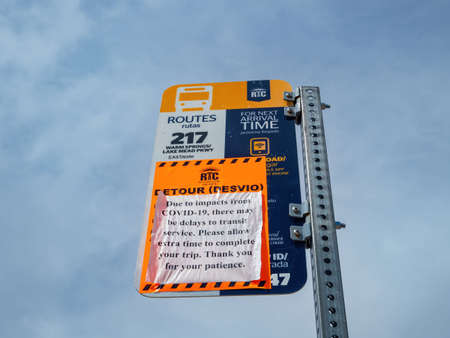 Henderson, MAR 23, 2020 - Bus stop sign delay notice of COVID 19のeditorial素材