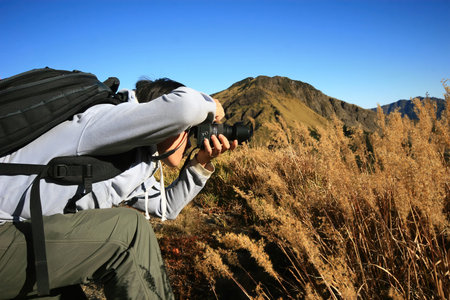 Photographer was taking picture of the beautiful landscape in Hehuan East Peak Trail at Nantou,...
