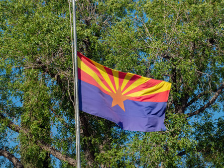 Sunny view of an Arizone flag swining and at half-staffの写真素材