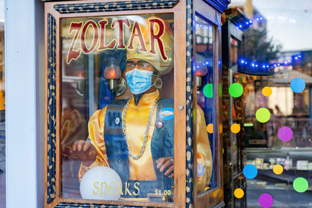 Las Vegas, JUN 23, 2020 -Close up shot of a Zoltar machine with face mask at Downtown Las Vegas