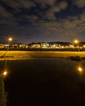 Night view of some cityscape with reflection in Xindian District area at Taipei