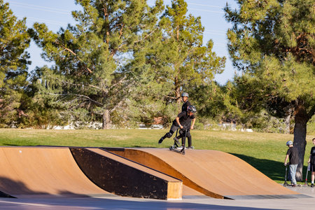 Boulder, Mar 16, 2021 - Child playing scooter at Skateboard park