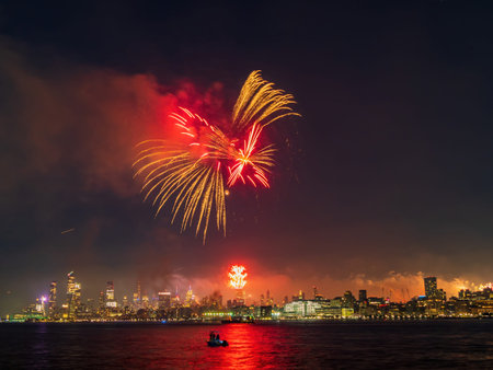 Fireworks celebration of July 4th with the famous Manhattan skyline at New York