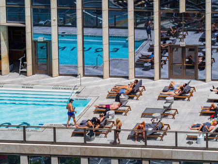 New York, JUL 4, 2021 - Sunny view of the Equinox Hotel New York with swimming poolのeditorial素材