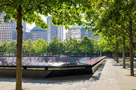 Close up shot of many America flags on the 9/11 Memorial South Pool at New Yorkのeditorial素材