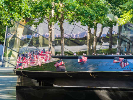 Close up shot of many America flags on the 9/11 Memorial South Pool at New Yorkのeditorial素材