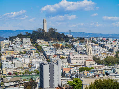 Sunny high angle view of some residence building with San Francisco Oakland Bay Bridge at San Francisco, Californiaの写真素材