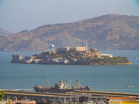 Sunny view of the Alcatraz Island and San Francisco Bay with some residence building at California