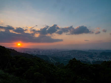 Sunset high angle view of the cityscape form Wenshan District at Taipei, Taiwanの写真素材