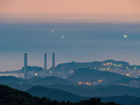 Morning sunrise high angle view of the mountains and cityscape around Wuzhi Shan at New Taipei City, Taiwanの写真素材