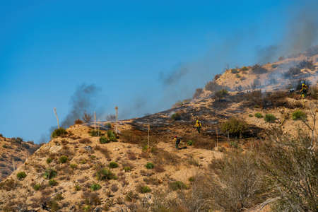 Firefighter was fighting with wild fire at Los Angeles, Californiaの写真素材