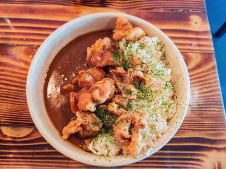 Close up shot of deep fried chicken with curry and rice at Oklahoma