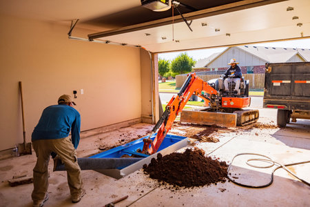 Oklahoma, OCT 19, 2021 - Worker was working on a garage underground storm shelter installation