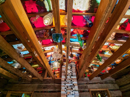 Tulsa, NOV 12 2021 - Many colorful bottle hanging in a wooden house of Philbrook Museum of Artのeditorial素材