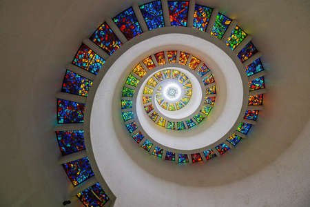 Dallas, NOV 25 2021, Looking up the colorful window of the chapel in Thanks Giving Squareのeditorial素材