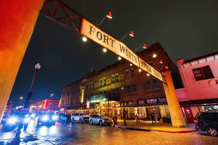 Fort Worth, NOV 27 2021, Night rainy view of the entrance of Fort Worth Stock Yardsのeditorial素材