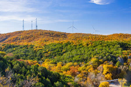 Beautiful fall color of the Turner Falls area with wind power tower at Oklahomaの写真素材