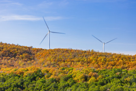 Beautiful fall color of the Turner Falls area with wind power tower at Oklahoma