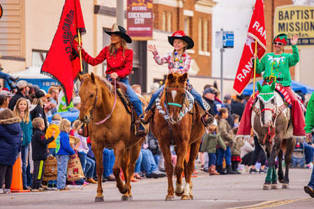 Oklahoma, DEC 4, 2021 - Cowboy and cowgirl riding horse in Cowboy Christmas Paradeのeditorial素材