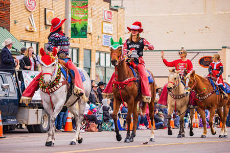 Oklahoma, DEC 4, 2021 - Cowboy and cowgirl riding horse in Cowboy Christmas Paradeのeditorial素材