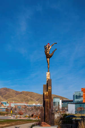 Salt Lake City, DEC 4 2021 - Gold statue with christmas decoration outside the Dumke Gymnastics Centerのeditorial素材