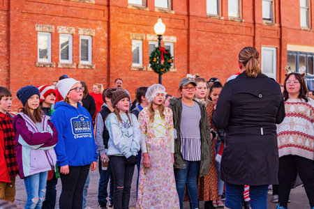 Guthrie, DEC 11 2021 - Night view of the Victorian Walk with child dress up in historical outfits and doing musical performanceのeditorial素材