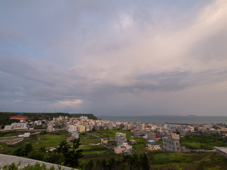 Sunset with fishing village at Penghu island, Taiwanの写真素材