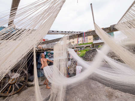 Penghu, Taiwan, JUN 18 2012 - Close up shot of people making the traditional Vermicelli noodleのeditorial素材