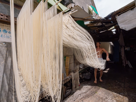 Penghu, Taiwan, JUN 18 2012 - Close up shot of people making the traditional Vermicelli noodleのeditorial素材