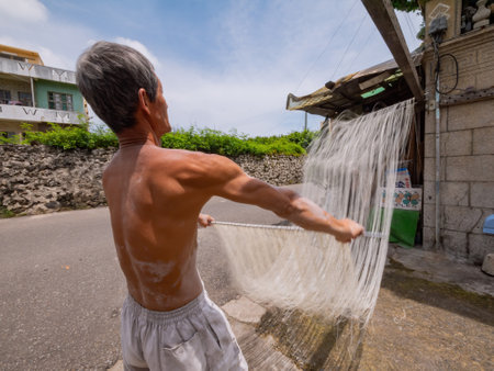 Penghu, Taiwan, JUN 18 2012 - Close up shot of people making the traditional Vermicelli noodleのeditorial素材
