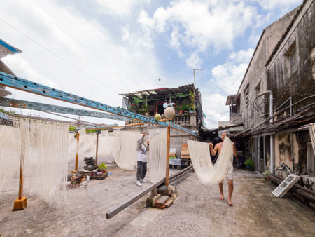 Penghu, Taiwan, JUN 18 2012 - Close up shot of people making the traditional Vermicelli noodleのeditorial素材