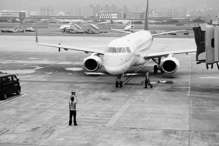 Taipei, JUN 15 2012 - Airplane parked in the Taipei Songshan Airportのeditorial素材