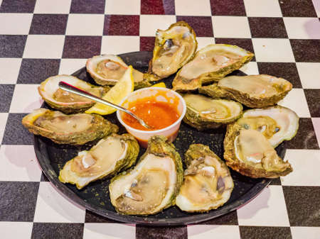Close up of many Half Shell raw oyster at Louisianaの写真素材