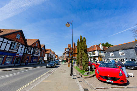 Lyndhurst, APR 2 2016 - Red Ferrari luxury car parked in the town of New Forest National Parkのeditorial素材