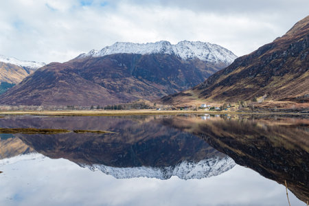 Sunny view of the beautiful lake, reflection on Causeway at Highland, Scotland