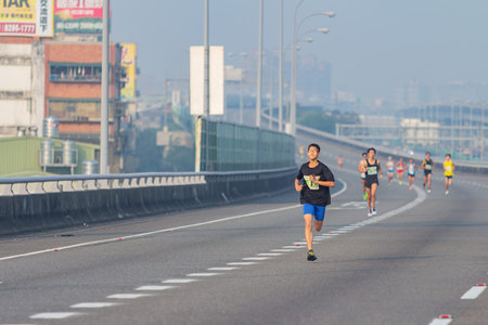 Taipei, MAR 17 2013 - Close up shot of people running in highway marathon