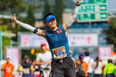 New Taipei, MAR 10 2013 - Close up shot of people running in cherry blossom marathonのeditorial素材