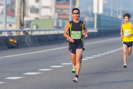 Taipei, MAR 17 2013 - Close up shot of people running in highway marathon