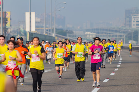 Taipei, MAR 17 2013 - Close up shot of people running in highway marathon