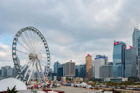 Hong Kong, JAN 1 2017 - Overcast view of the Hong Kong Observation Wheel, Christmas market and cityscapeのeditorial素材